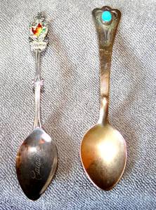 lot 169 image: PAIR OF STERLING COLLECTORS SPOONS