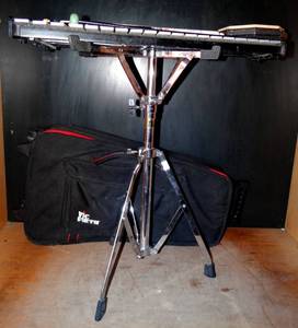 lot 203 image: VIC FIRTH PERCUSSION KIT WITH BELLS, STAND, STICKS, DRUMPAD, AND STORAGE CASE $$$