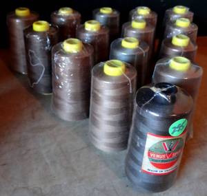 lot 295 image: 100 % POLYESTER SEWING THREAD (EMBROIDERY) 15 ROLLS BEIGE & BROWN TONES AS SHOWN (APPROX 6000 YRDS EACH) 15x$