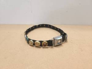 lot 132 image: Seatbelt belt with beer bottle caps
