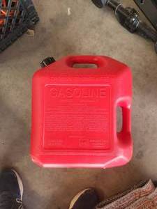 lot 263 image: Red 5-gallon gas can
