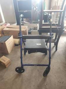 lot 180 image: Drive - 4 wheeled walker with hand brakes and seat