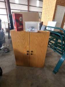 lot 104 image: Electronic dart board in wood cabinet with accessories