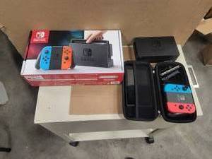 lot 114 image: Nintendo Switch game and extras