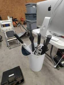 lot 156 image: Trash can with selection of umbrellas