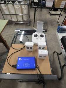 lot 147 image: Phantom 4 batteries and charger