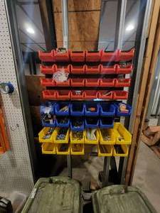 lot 214 image: Plastic bins on wall and contents - need to be removed from wall