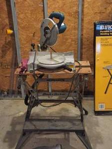lot 274 image: Makita miter saw with stand
