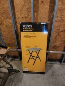 lot 256 image: Klutch Portable folding welding table - never opened