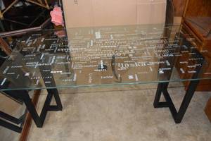 lot 9 image: Glass Top Table with White Printed Words