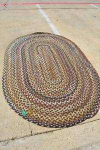 lot 25 image: Oval Braided Area Rug