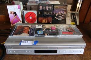 lot 30 image: Toshiba VHS and DVD Player with CDs and DVDs as shown