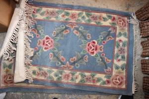 lot 60 image: Pair of Lt. Blue Wool Rugs 24x42