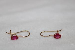 lot 120 image: 14K yellow gold and faceted Ruby French ear wire earrings, Rubies tested (approx. .50 carat oval each). Matches Ruby pendant necklace in Lot #108