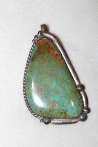 lot 133 image: Sterling silver Turquoise statement pendant with large bale. Marked Sterling with large R. 3.0L x 1.5W approx.