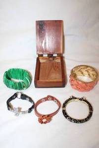 lot 180 image: Bracelet selection and artisan crafted wooden box with leather fasteners