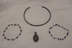 lot 183 image: White metal jewelry. Possibly Sterling - please preview. Includes omega collar, Pendant and 2 bracelets