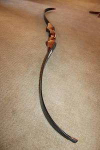 lot 11 image: Hand-made Recurve Bow - 57 length unstrung needs a string
