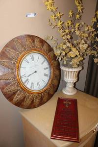lot 43 image: 23 Round Wall Clock, Dried Yellow Flowers in Urn Style Planter, and Scripture Wall Plaque
