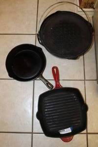 lot 54 image: Cast Iron Skillets 10 Round, 11 Square and 12 Lodge Dutch Oven