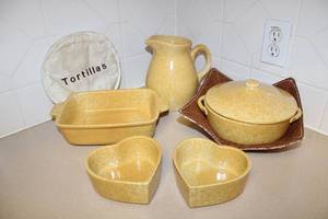 lot 66 image: Yellow Coche Stoneware Cookware Set