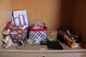 lot 75 image: Plush Toys, Womens Gloves, Christmas Gift Bags, Sewing Supplies, and Small Bags
