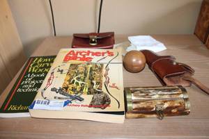 lot 84 image: Gun Holster, Archers Bible and Woodcarving Book, Leather Pouch, Wooden Ball