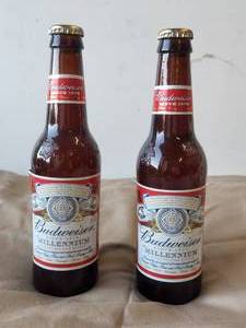 lot 44 image: Selection of 2 fullunopened Budweiser Millennium beers - being sold as a collectible not for consumption