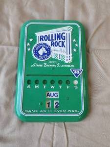lot 46 image: Vintage Rolling Rock Beer advertisement metal Calander