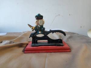 lot 56 image: Vintage nutcracker on wood stand