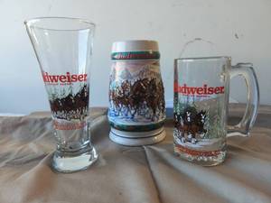 lot 79 image: Selection of Budweiser steins and glasses
