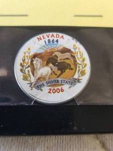lot 105 image: 2006 uncirculated Kennedy half dollar with statehood Quarters image imposed on face - image is enlarged and colorized
