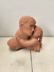 lot 194 image: Little clay statue of Father and Daughter