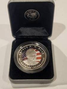lot 253 image: George H. Bush 80th Birthday coin - 4180 - The Pirth Mint