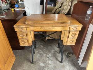 lot 229 image: Vintage Oak and Iron sewing machine cabinet on casters