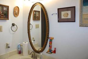 lot 68 image: Bathroom Contents Oval Mirror and Dcor
