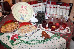 lot 111 image: Christmas Lot Apron, Santa Plates, Candles, Celebration Crackers