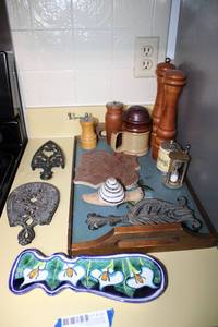 lot 130 image: Metal Trivets, Salt and Pepper Grinders, and Tray