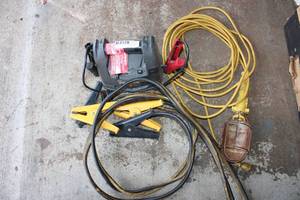 lot 191 image: Battery Cables, Portable Battery Charger, Extension Cord Work Light with Metal Guard