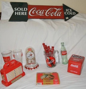 lot 44 image: Coca-Cola Lot Metal Sign, Playing Cards, Tins, Spoons and Knives, Polar Bear Clock and Glasses
