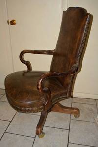 lot 19 image: Brown High Back Executive Arm Chair with Riveted Trim, 27W x 43.5 Back Height