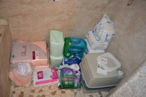 lot 63 image: Bladder Control Pads and Briefs, Plus Portable Toilet