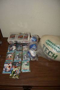 lot 69 image: Baseball Cards - Nolan Ryan and Nascar, Plush White and Green Tech Football, and Wisk Baseballs