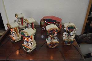 lot 112 image: Vintage Mr. Christmas Holiday Carousel - Lights up and Plays Music