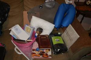 lot 194 image: Misc. Cozy Lot Cozy Wrap, Neck Pillows, Books, Small Fan, Plastic Bowls