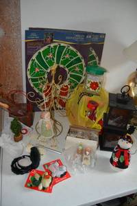 lot 380 image: Christmas Lot Miniature Bear Nativity, Glittery Angel Wind Chime, Outdoor Solar Lights, and Lighted Christmas Wreaths