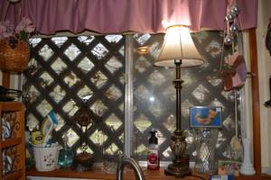 lot 395 image: Kitchen Ledge Lot Tall Table Lamp, Hanging Decorations, Bear Scrubbing Pad Holder, Vases, Test Tube Bud Vases, and Decorative Cross
