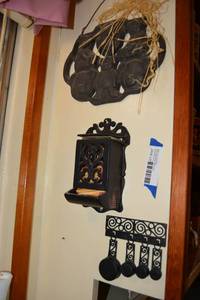 lot 397 image: Cast Iron Decorations Match Holder, Corn Stick Pan, Bear Molds, and Miniature Skillets