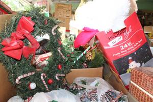 lot 556 image: Christmas Wreaths, Lighted Fluffy Dog with Gift Box