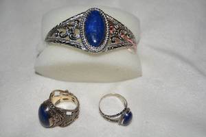 lot 602 image: (3) Boxed Strada Stainless Steel cuff bracelet with cabochon Lapis Lazuli. Has retail tag attached. Also has two Sterling Silver Lapis Lazuli rings. Both marked 925. Sizes 9 and 9.5